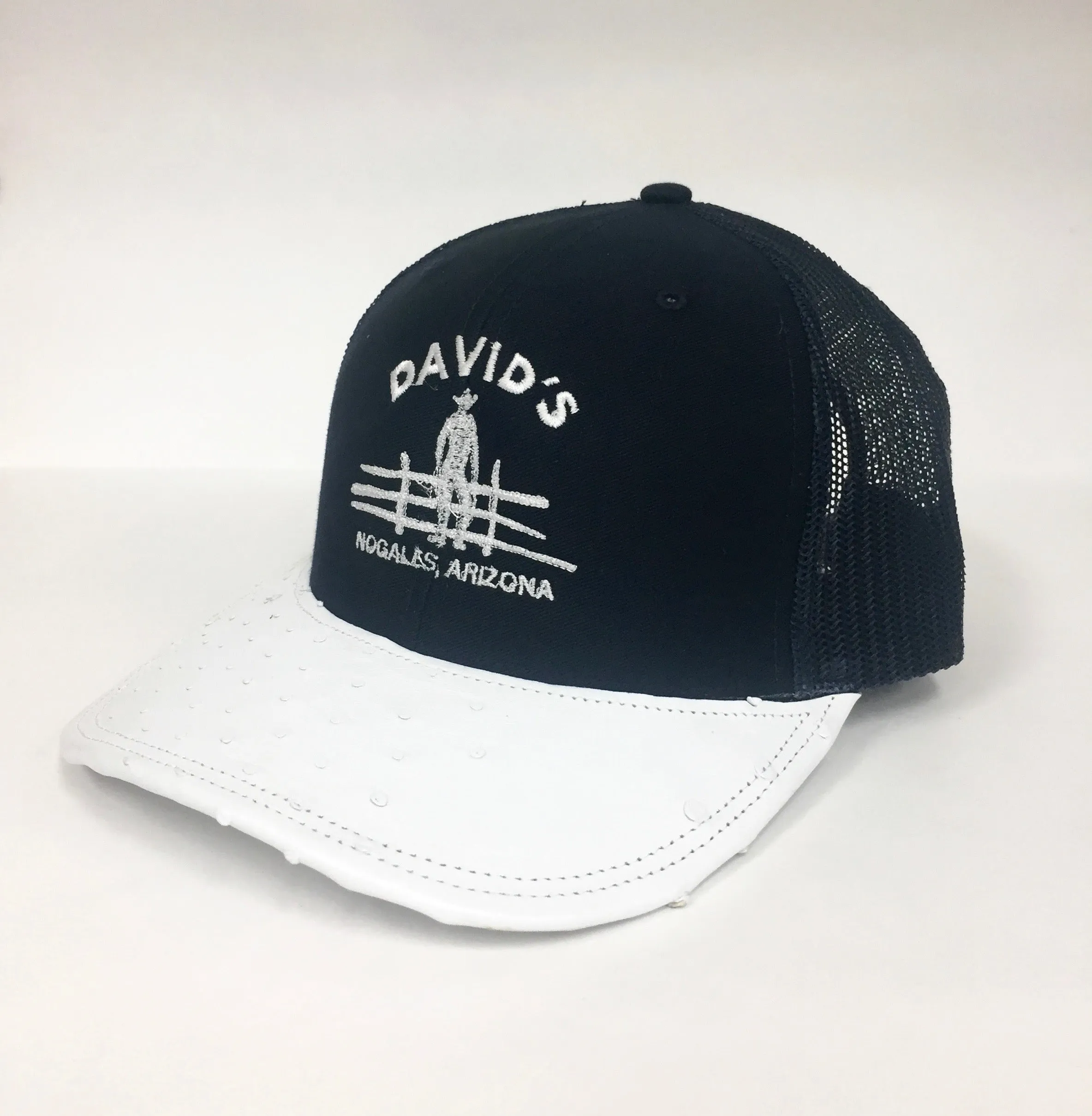 Black cap with white half quill ostrich visor
