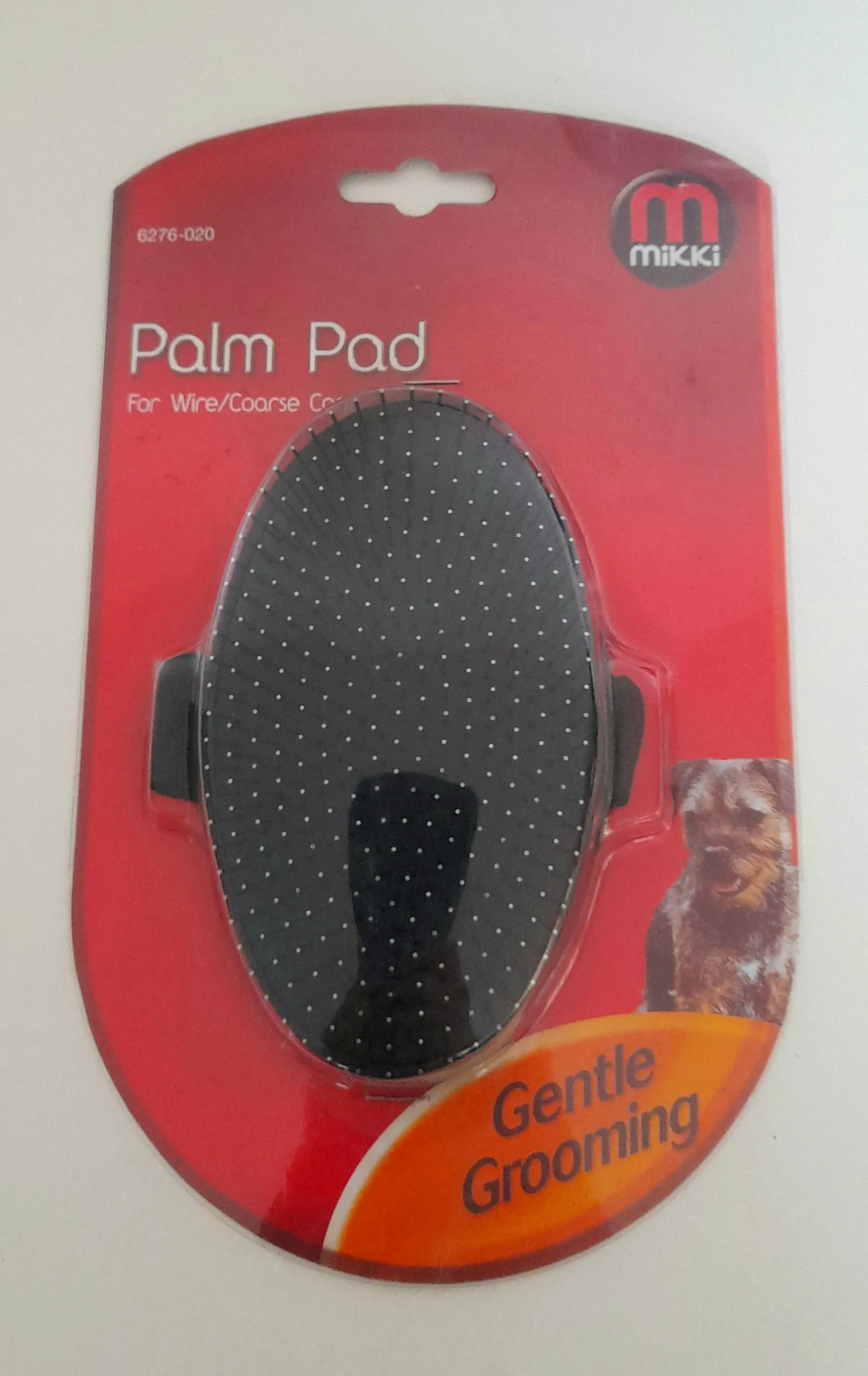 Palm pad wire grooming brush